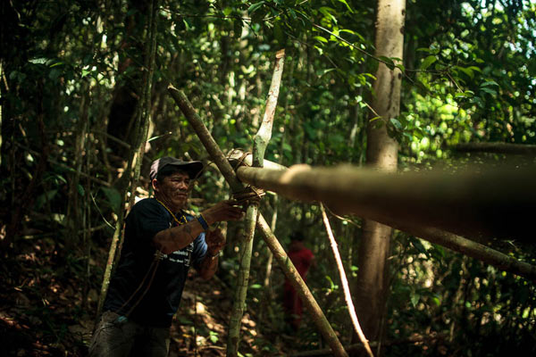 The Munduruku set up camp in the middle of the woodland. Photo credit: Marcio Isensee e S&aacute;