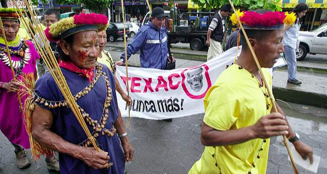 Secoya elders march to the Superior Court of Justice Courthouse in Lago Agrio at the start of the trial against Chevron Texaco. Photo Credit: Lou Dematteis from Crude Reflections