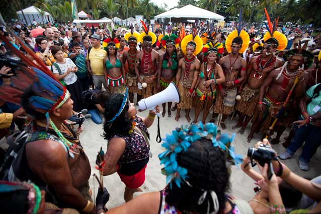 Sonia Bone Guajajara, VP of the Coordination of the Indigenous Organizations of the Brazilian Amazon (COAIB), addresses indigenous marchers on Rio's Flamengo Beach on June 19, 2012.