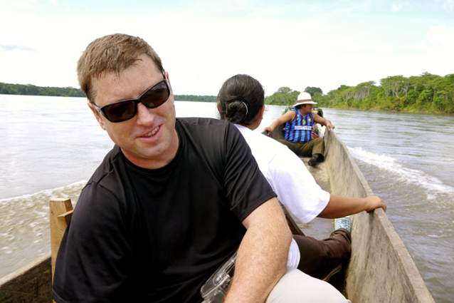 Aaron Isherwood in dugout canoe on the Rio Pastaza