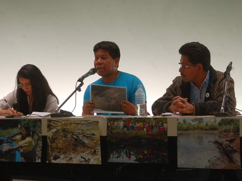 Humberto Piaguaje, of the Secoya people, spoke in Paris on behalf of five tribes and campesinos in Ecuador, about the pollution caused by Chevron/Texaco. Photo credit: Karen Hoffmann.