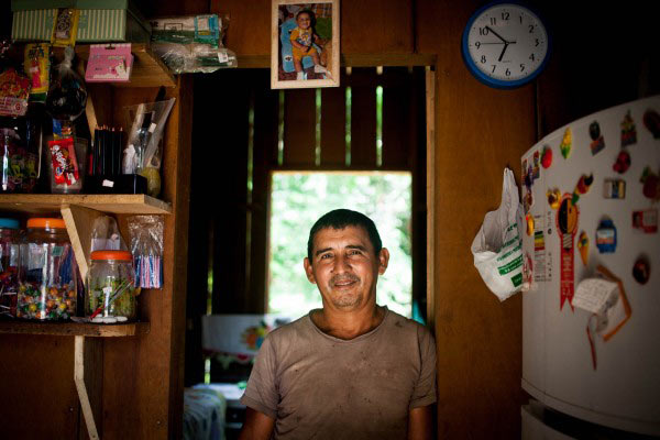The fisherman Tatá in one of two houses he built with income from fishing. Photo credit: Marcio Isensee e Sá
