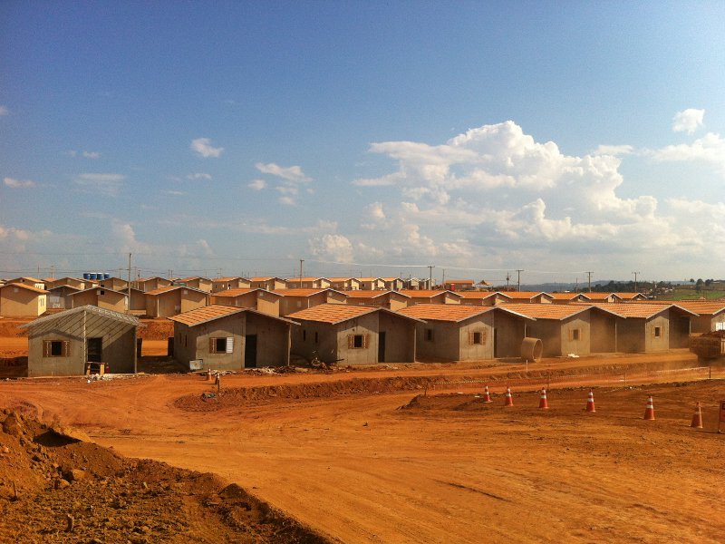 Concrete shacks crammed into a sweltering lot: 'dignified housing' for displaced families?