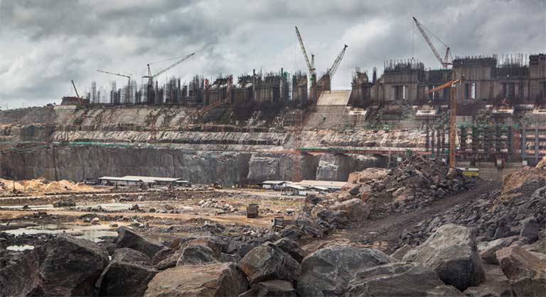 Construction site of the Belo Monte dam, on the Xingu river, Brazil. There have been important failings in the licensing process here, say government critics, including a deeply flawed Environmental Impact Assessment, and a lack of free, prior and informed consent for affected communities. Photo credit: Carol Quintanilha / Greenpeace