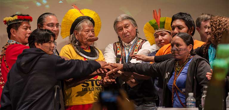 Munduruku representatives gathered with international environmental leaders in Paris during the December 2015 United Nations climate change summit (COP 21) and presented their case against the Brazilian dams. Photo credit: Fábio Nascimento/Greenpeace.