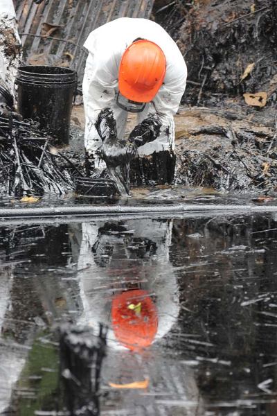 The oil was initially confined to a stream, which overflowed with heavy rains on February 9. Photo credit: Barbara Fraser.