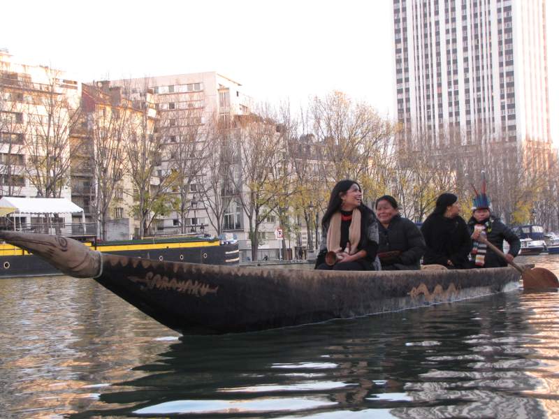 Sarayaku delegates rowing the Canoe of Life.