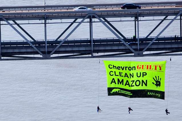Daring activists from Amazon Watch and Rainforest Action Network rappelled from the Richmond-San Rafael Bridge to hang a 50-foot banner demanding justice for Chevron's crimes in the Ecuadorian Amazon.